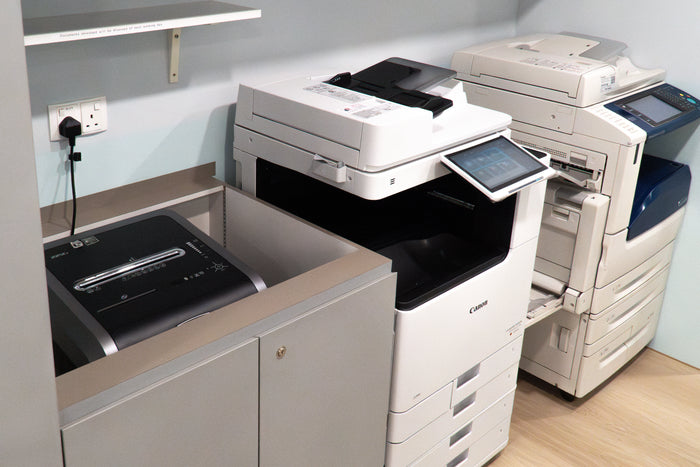 A Fellowes 225ci is pictured on the left, the Canon image runner advance DX C922i in the center, and a DocuCentre-V C3375 on the right.