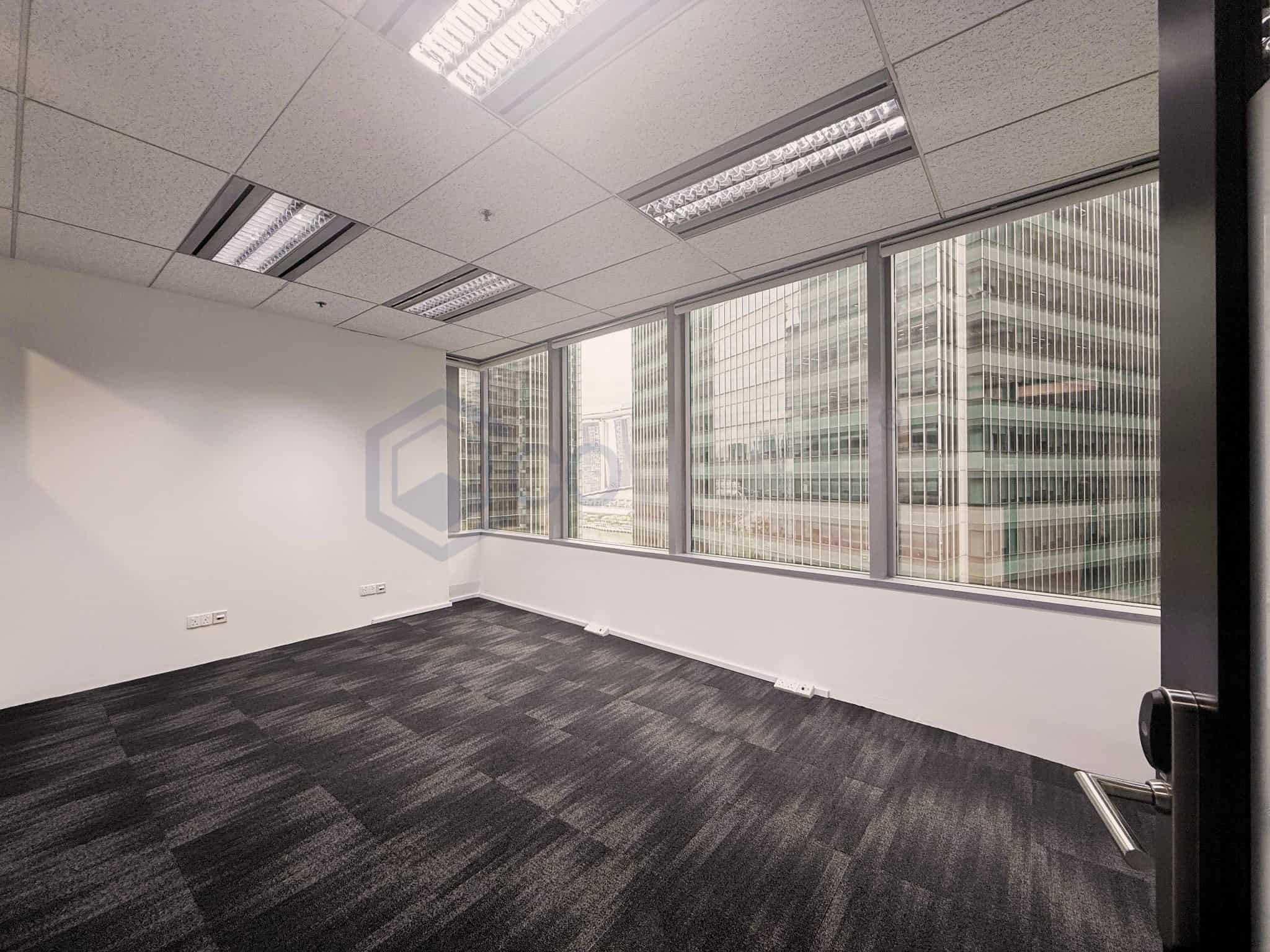 Office space with large windows, natural light, and flexible bare units for custom office design.