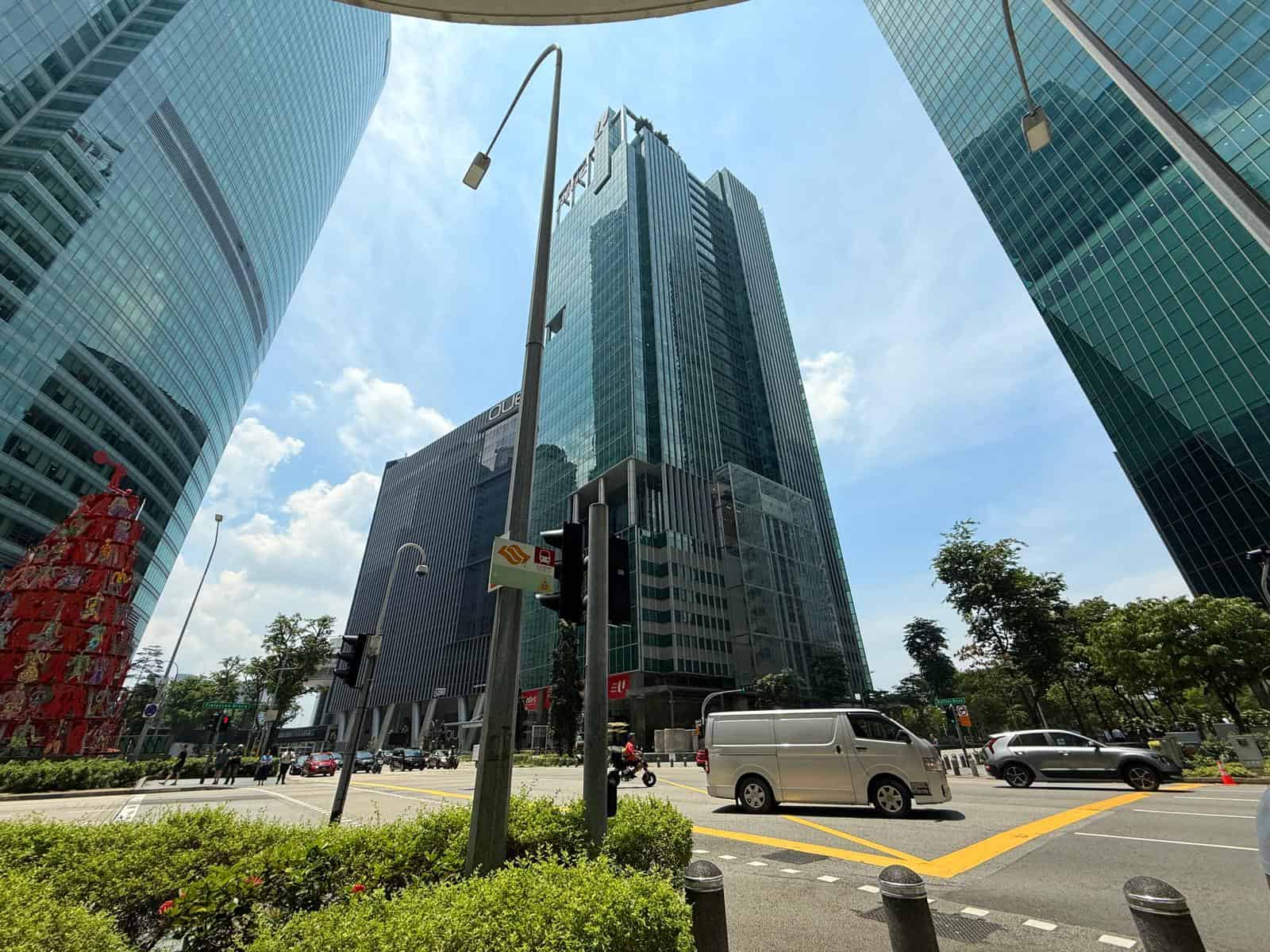 Office buildings in a busy urban area with high-rise glass towers.