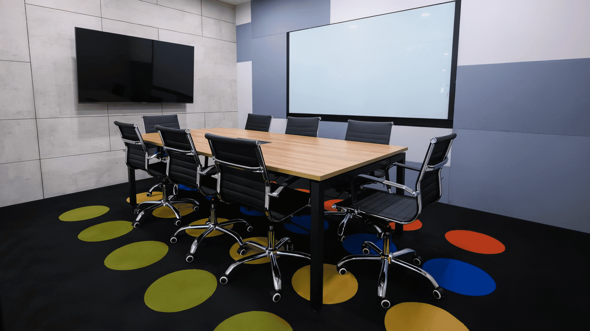 Modern CoWorking Meeting Room Contemporary coworking meeting room with a large table and ergonomic chairs.