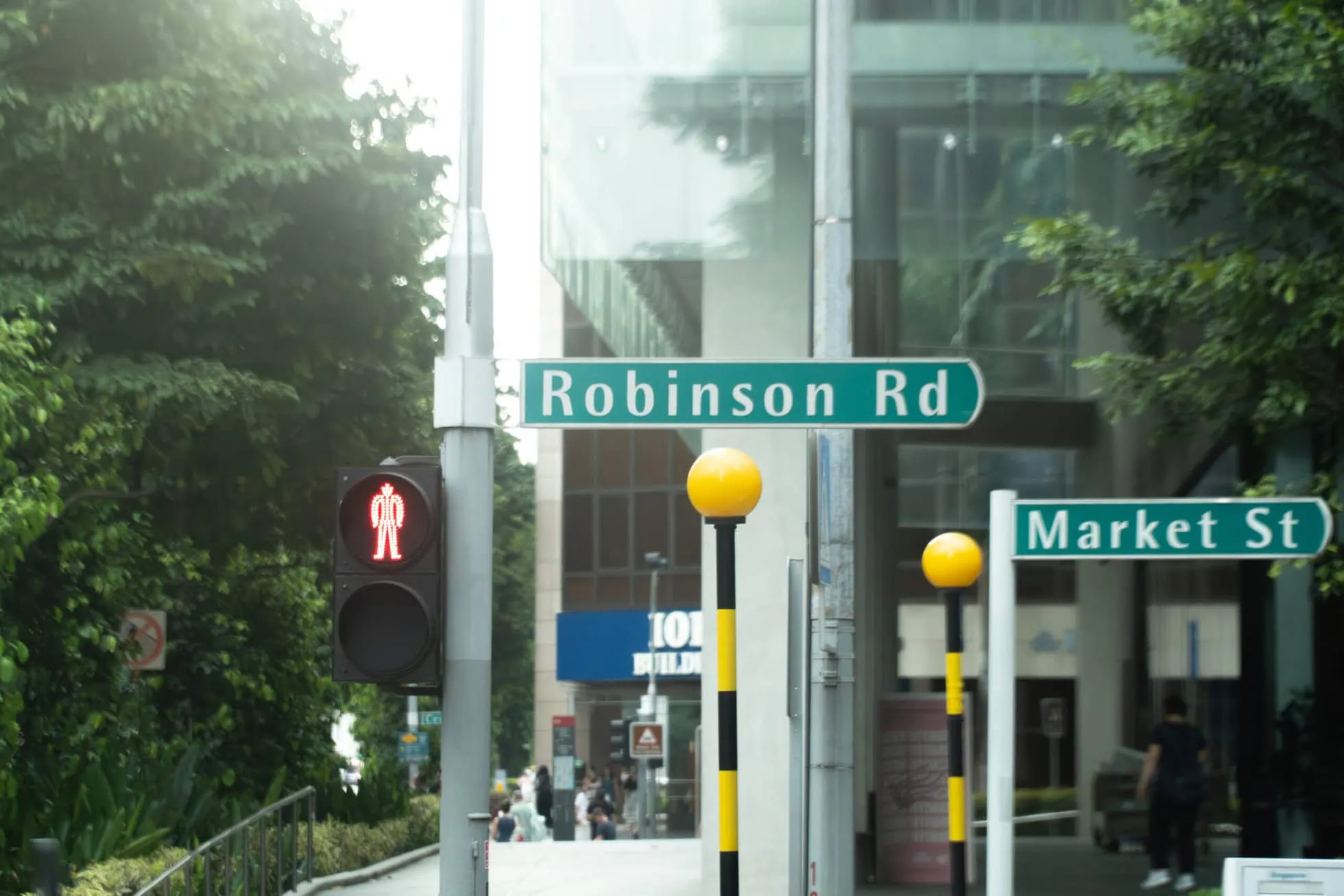 Robinson Road and Market Street street signs in Singapore city centre.