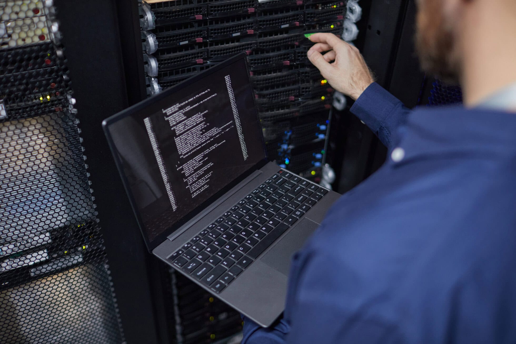 IT technician managing server hardware in a high-end serviced office environment.