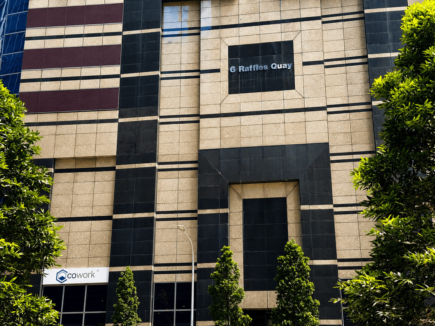 Modern office building entrance in Raffles Quay.
