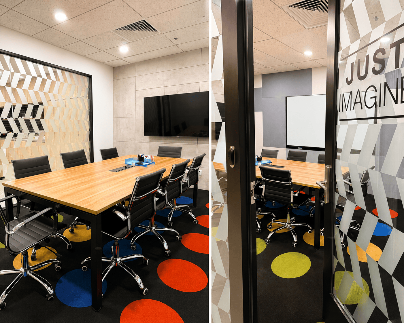 Modern coworking meeting room with large table and black chairs at CoWorkSpace Singapore.