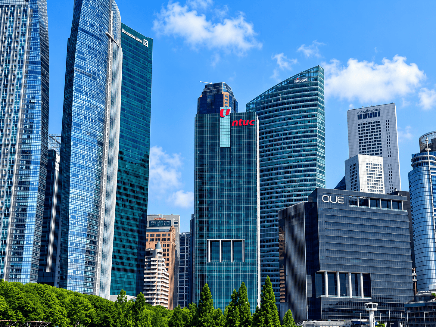 Marina Bay Buildings Modern Singapore skyscrapers with blue sky and green trees in foreground.