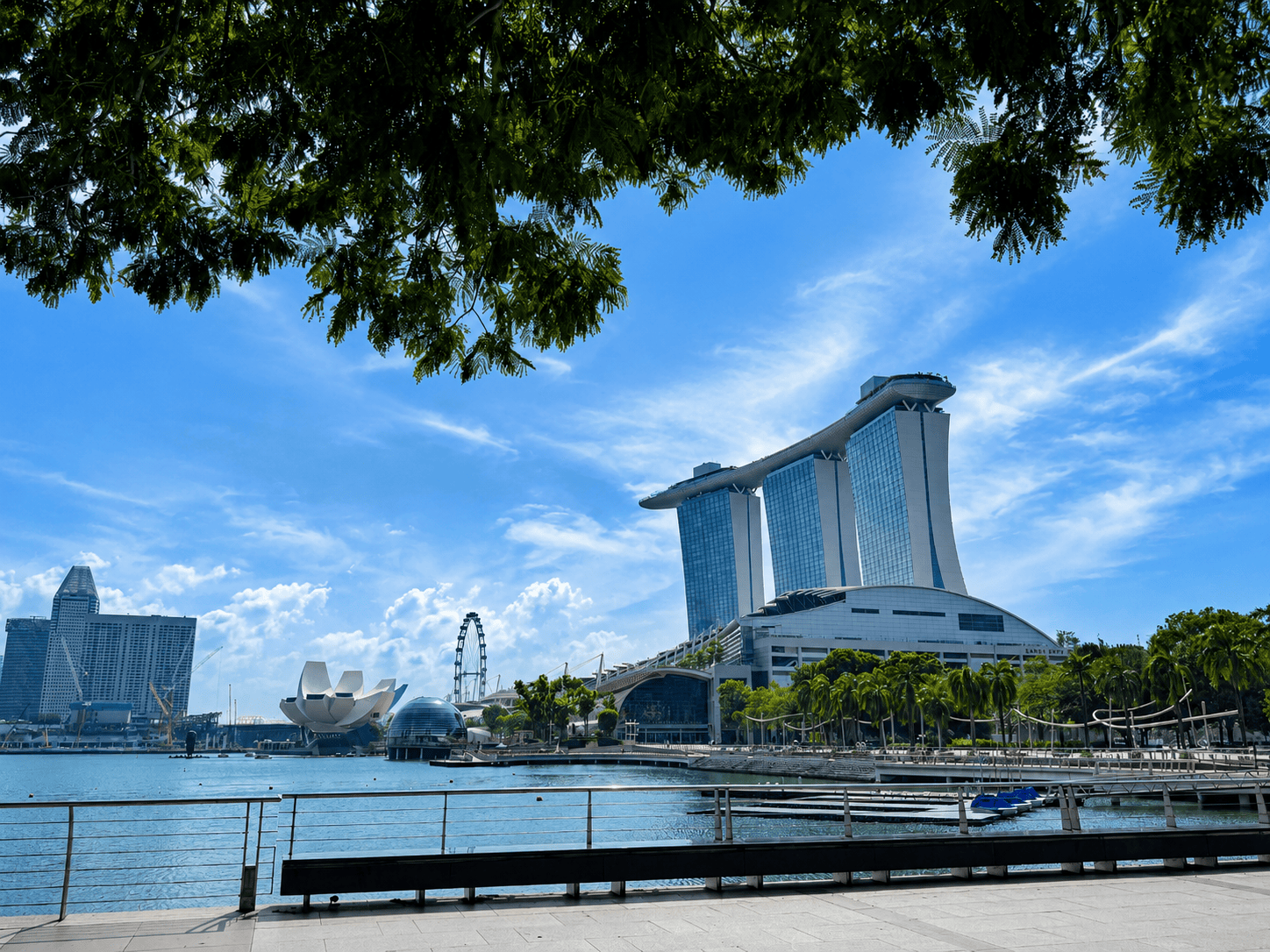 Marina Bay waterfront and skyline view Singapore skyline with Marina Bay Sands and ArtScience Museum on a sunny day.