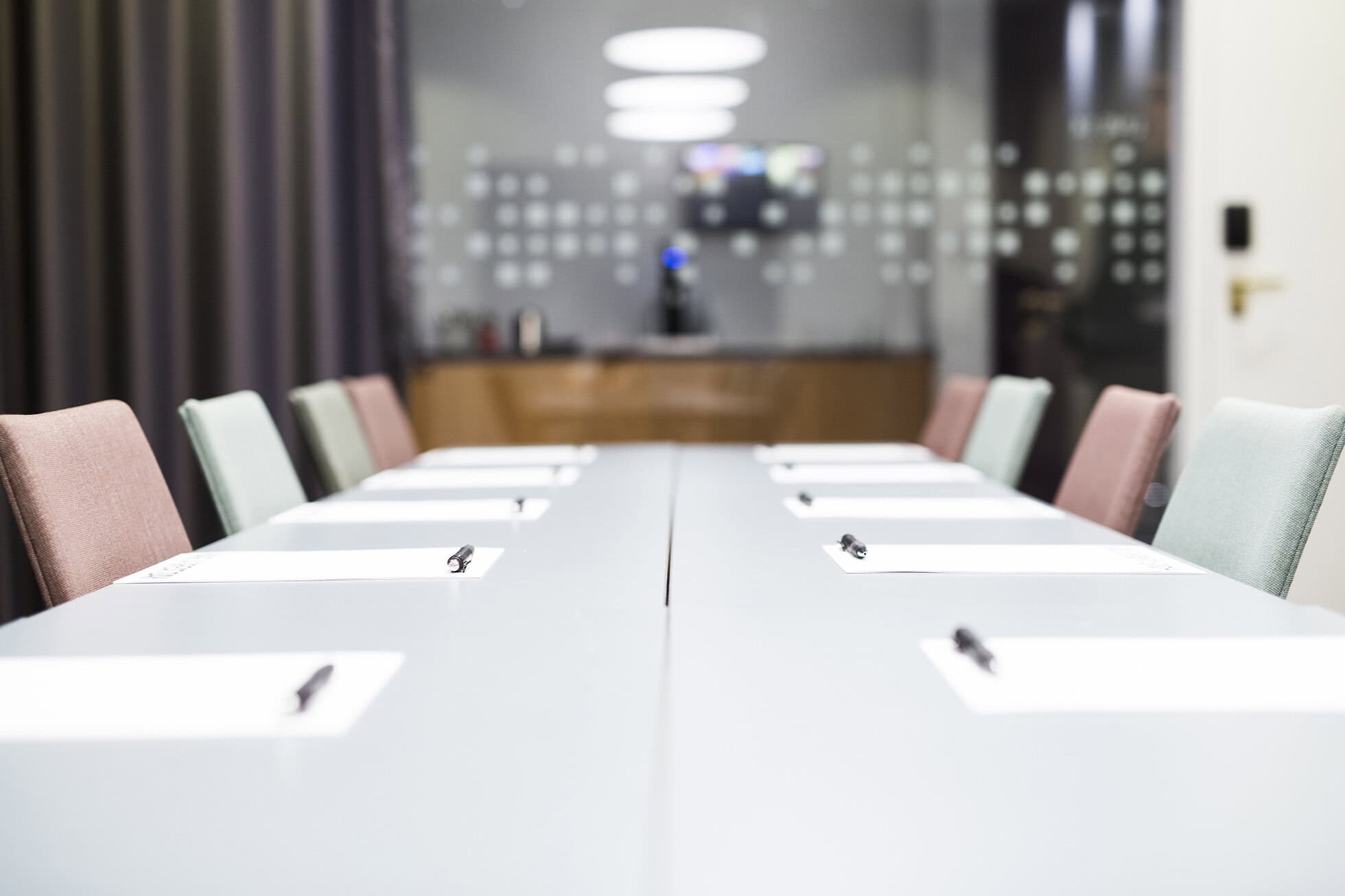 Empty conference room awaiting attendees Modern coworking office with large windows and cityscape view for healthcare business satellite offi.