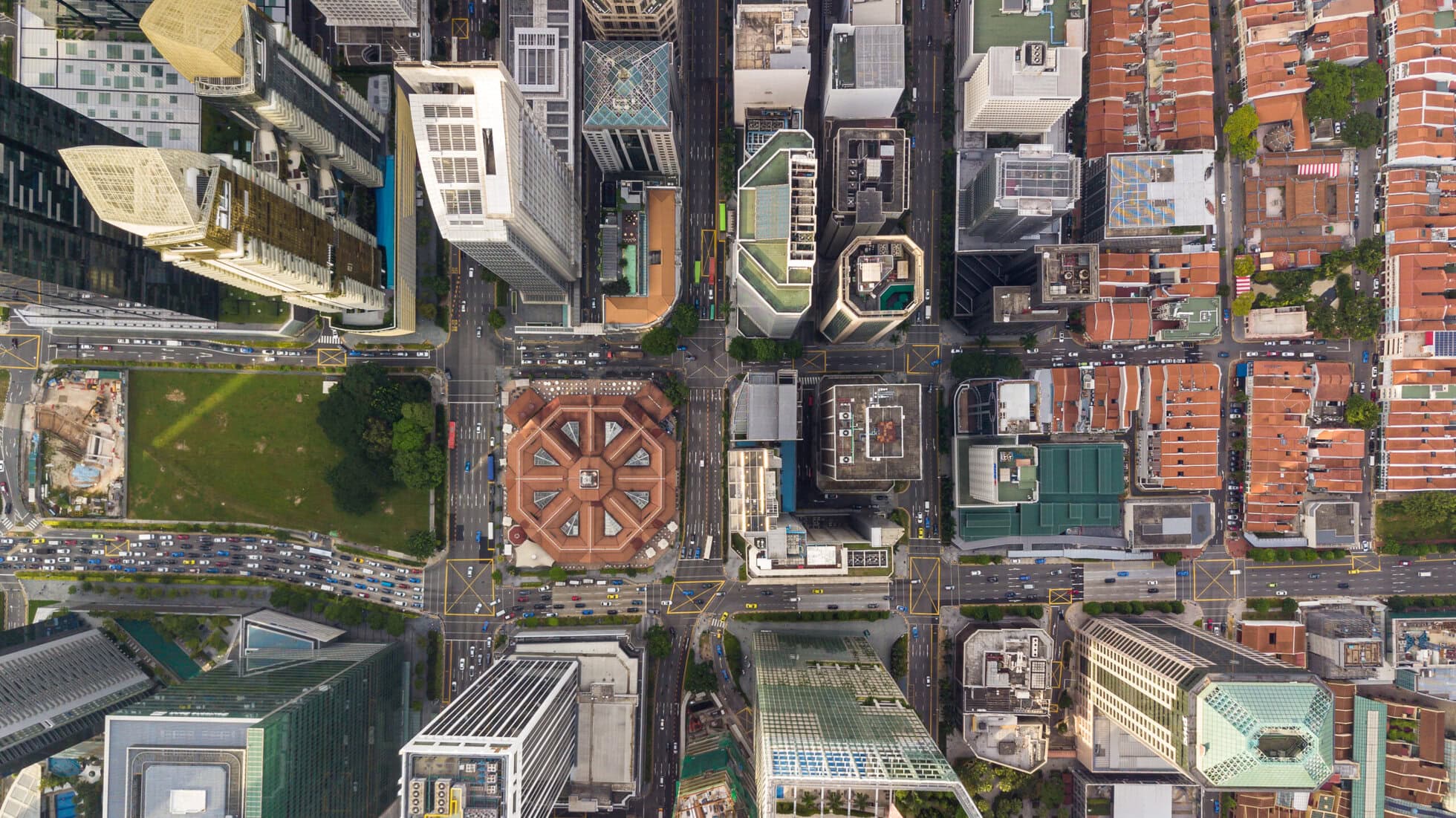 Aerial top view Singapore city highway traffic in city at mornin Modern office building at CoWorkSpace in Singapore for professional workspaces.